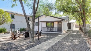 A two-story house with a patio area, outdoor seating, and a small deck. - Historic Prescott Gem! Walk to Whiskey Row! (Prescott)