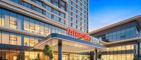 A modern hotel with a prominent 'Intercity Hotel' sign.