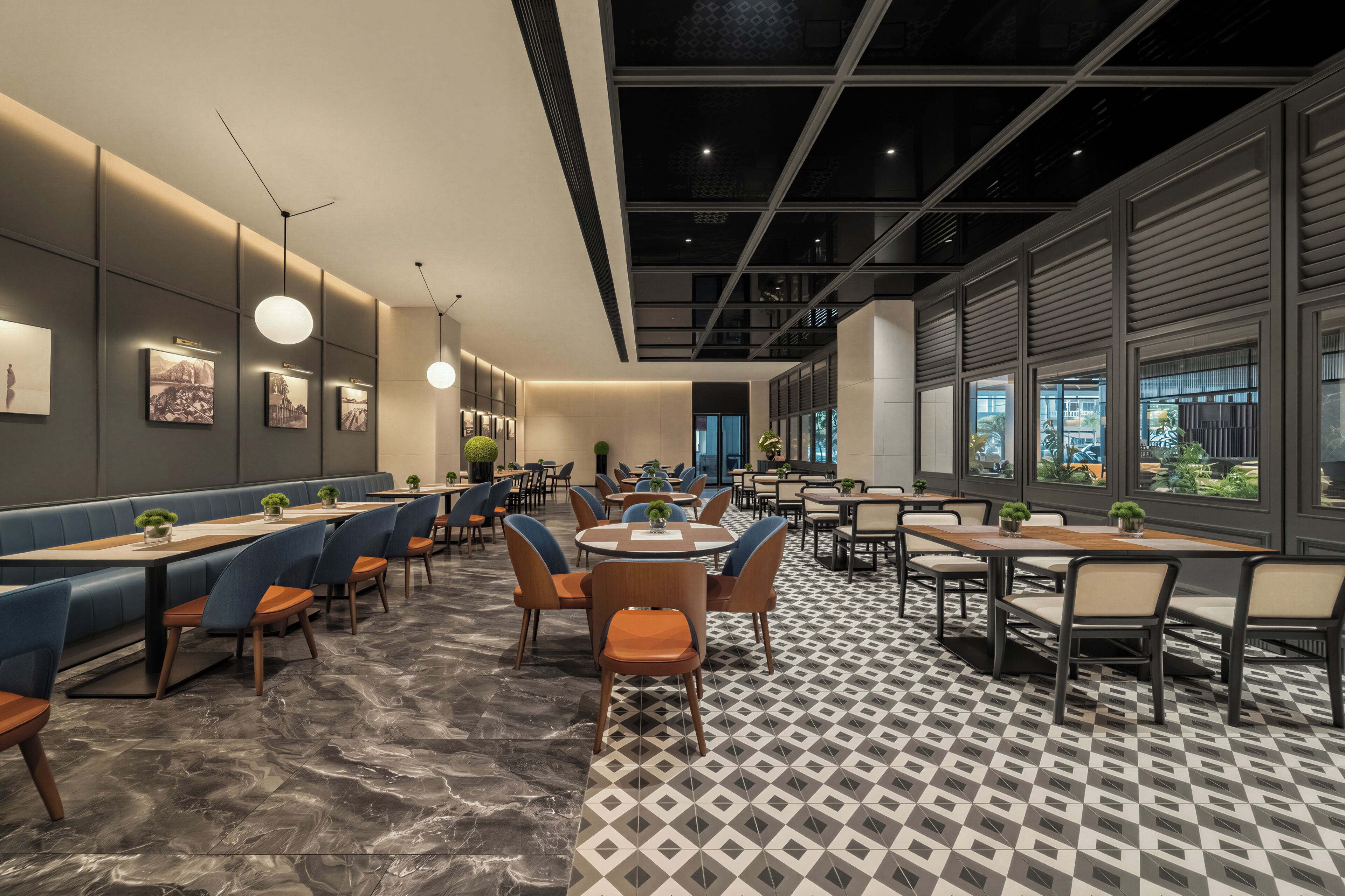Un interior de restaurante moderno con cabinas, mesas y un suelo estampado.