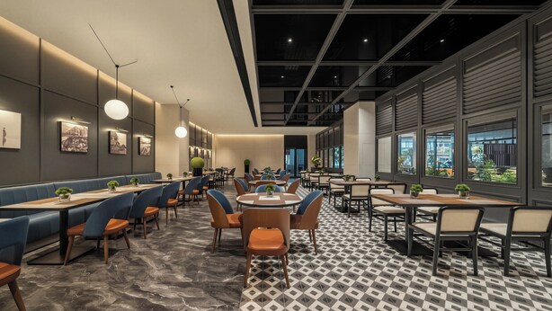 A modern restaurant interior with booths, tables, and a patterned floor.