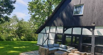 Chalet exclusif au toit de chaume avec installations de bien-être