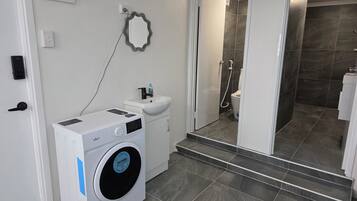 Bidet, towels, soap, toilet paper