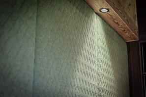 A textured wall with a recessed ceiling light. - Chalet Double Room for 2 Guests at Lake Wolfgang | spatzenNEST (Strobl)