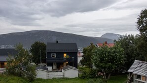 A house with a dark roof, a balcony, and a small porch area. - Arctic Comfort 2, Tromsø (Tromsø)