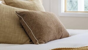 A bed with two pillows and a blanket. - Cosy Retreat w/ Sauna & Fire Pit | Golf & Beach (preston beach)