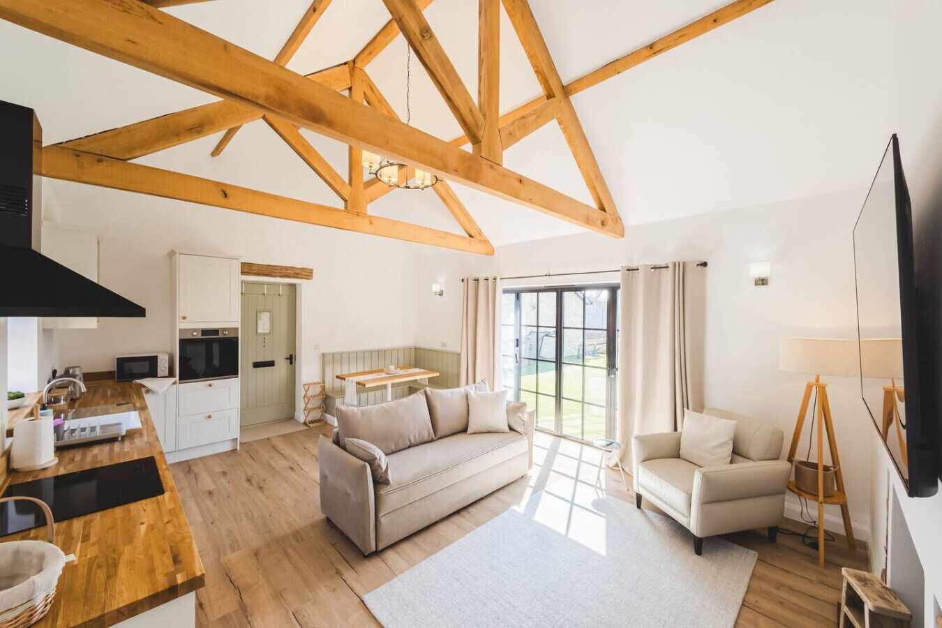 Natural light and high ceilings make the room feel even more spacious.