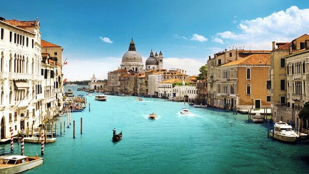 A canal with boats, historic buildings, and a prominent dome structure. - Campiello Chiesa, Venezia (Venice)