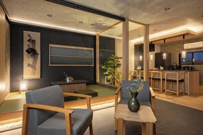 A modern interior with a dining area, a kitchen, and a seating space with a plant. - JAPAVISTA Maverique (KONOHANA WARD)