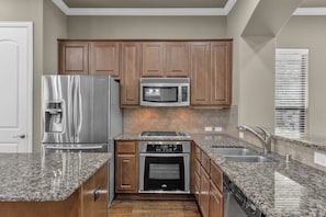 Fridge, microwave, oven, stovetop - Townhome Located in the heart of Legacy Shops (Plano)
