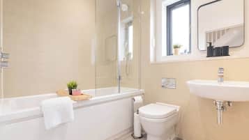 Shower, hair dryer, towels, shampoo