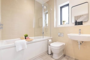 Shower, hair dryer, towels, shampoo