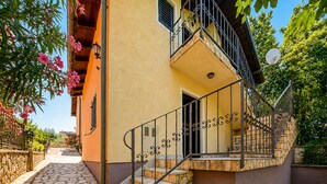 A two-story building with a stone staircase, a balcony, and a door leading to the entrance. - Awesome home in Krusevo with WiFi (Krusevo)