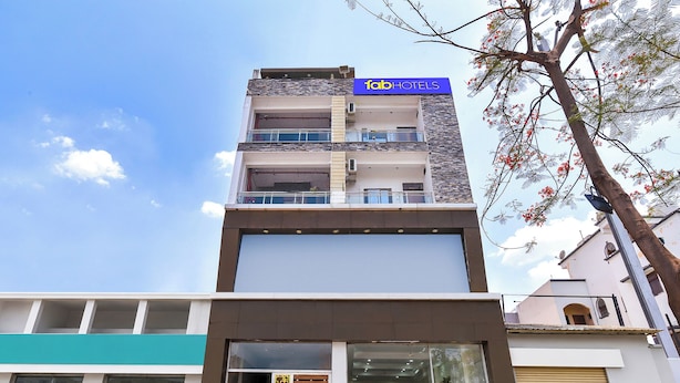 A multi-story building with a sign for 'fab hotels' on the top. - FabHotel Metro Residency (Indore)