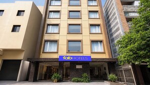 A multi-story hotel with a flat facade, large windows, and a sign for 'fabHOTELS' at the entrance. - FabHotel Karol Bagh Residency - Nr. Karol Bagh Market (New Delhi)