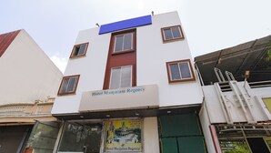A building with a sign reading 'Hotel Manjula Regency.' - FabHotel Manjulam Regency (Indore)