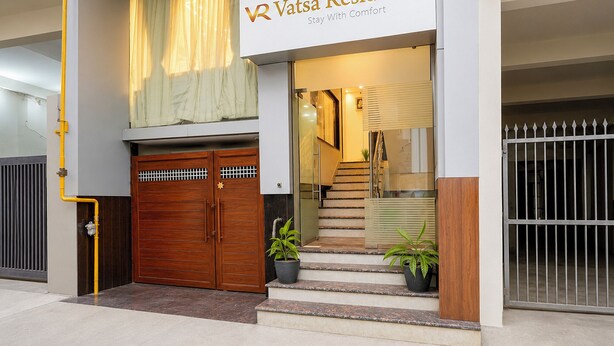 A modern building with a sign reading 'Vatsa Residence Stay With Comfort'. - Fabhotel Vatsa Residency (Varanasi)