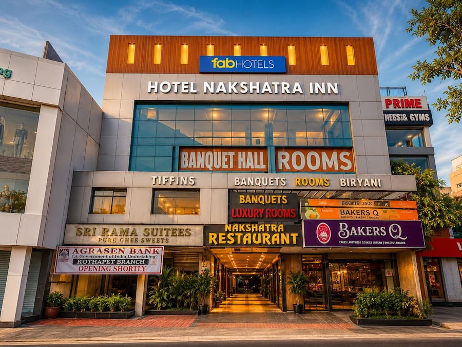 Hotel Nakshatra Inn with a sign for Banquet Hall Rooms and a visible restaurant.