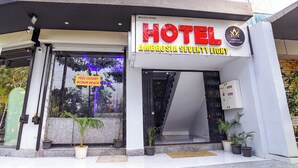 A hotel entrance with a sign reading 'HOTEL AMBROSIA SEVENTY EIGHT' and a 'FEEL LUXURY WITHIN REACH' sign. - FabHotel Ambrosia Seventy Eight (Indore)