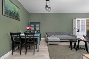 Living area - Cozy Apartment with a Balcony, Near Parks and the Partynice Racetrack by Noclegi Renters (Wrocław)