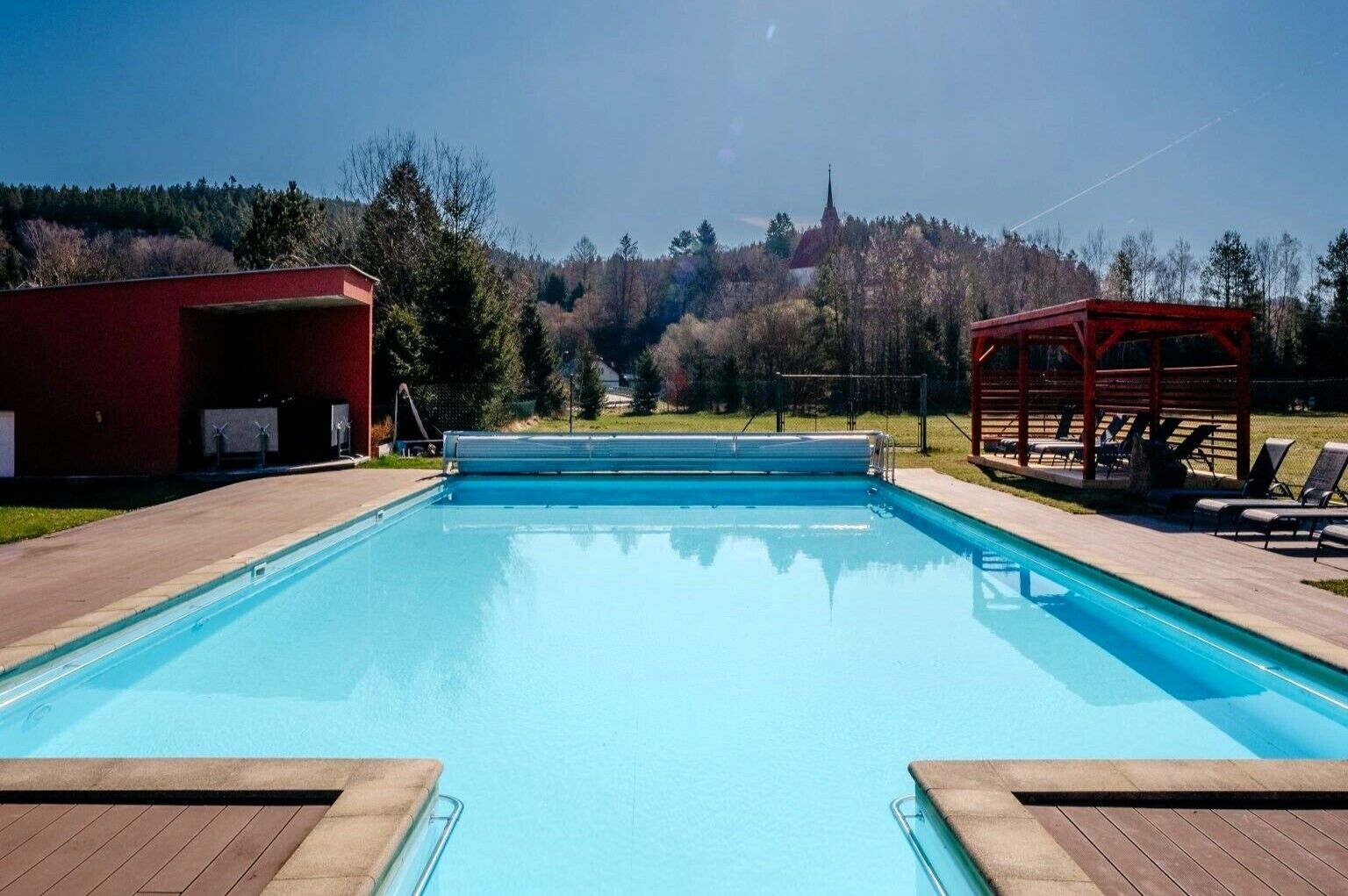 Indoor pool, seasonal outdoor pool, pool umbrellas, pool loungers