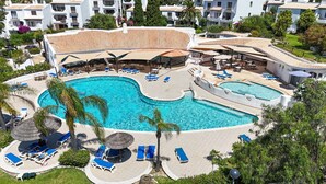 A resort with a large central pool, multiple smaller pools, and sun loungers. - S o Rafael Apartment by Minhos Guest (Albufeira)