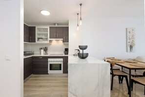 Private kitchen - Modern, fully furnished apartment with ocean views (AN)