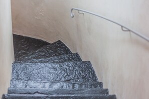 A staircase with a textured surface, leading upwards.