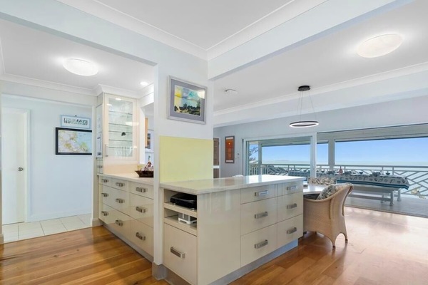 A fully equipped kitchen with oven, stove, drawer warmer, steam oven and microwave, plus everything you need to cook and entertain. Enjoy the 4-seater dining table inside or dine alfresco outdoors.