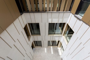A modern interior with a geometric floor plan, large windows, and a minimalist design. - Bright Apartment in the Heart of Valladolid Solanilla IV (Valladolid)