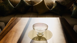 A room with a sofa, a table with a glass bowl, and sheer curtains. - A Luxurious, Modern, Central Gem + Netflix (Marrakesh)