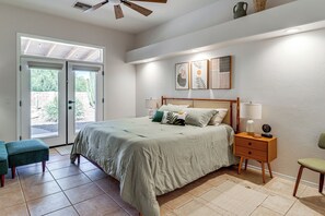 A bedroom with a bed, bedside tables, a bench, and a ceiling fan. - Saguaro Sanctuary: Tucson Home w/ Outdoor Oasis (Tucson)