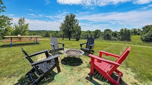 An outdoor seating area with Adirondack chairs and a fire pit. - Families Welcome! Corinth Escape w/ Lake Views (Corinth)