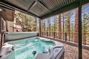 A hot tub with a view of tall pine trees. - Lake Views, Hot Tub Pool Table, Close To Heavenly! 3765o 4 Bedroom Home (South Lake Tahoe)