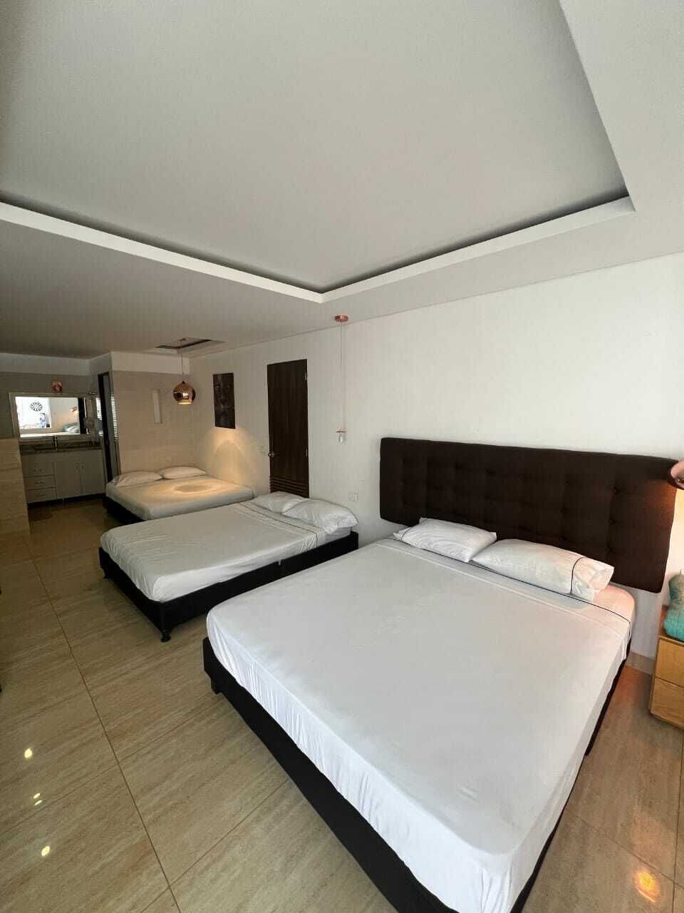 Deluxe Triple Room, Pool View | Desk, laptop workspace, free WiFi, wheelchair access