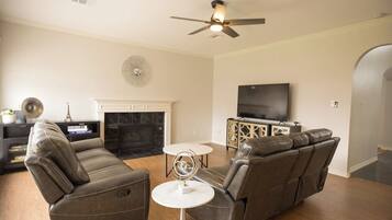 Smart TV, fireplace, foosball, books