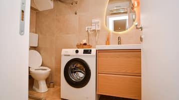 Shower, hair dryer, towels, soap