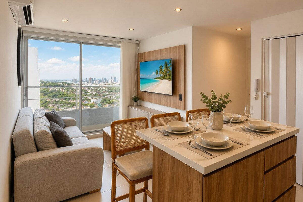 Un apartamento moderno con comedor, sofá y televisor montado en la pared.