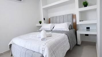 Deluxe Apartment, 3 Bedrooms, Pool Access, Sea View | Down comforters, individually decorated, individually furnished