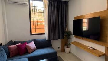 Deluxe Studio, City View | Living area | 45-inch Smart TV with digital channels
