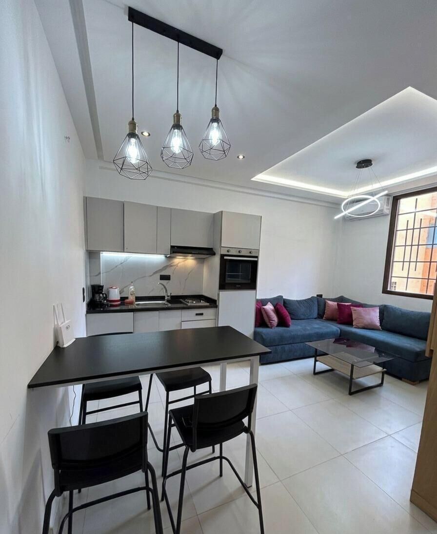 Deluxe Studio, City View | Living area | 45-inch Smart TV with digital channels
