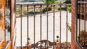 A balcony with a view of a rural landscape, including fields and distant hills. - Vineyard-View Country House with BBQ & Fireplace (El Pla del Penedès)