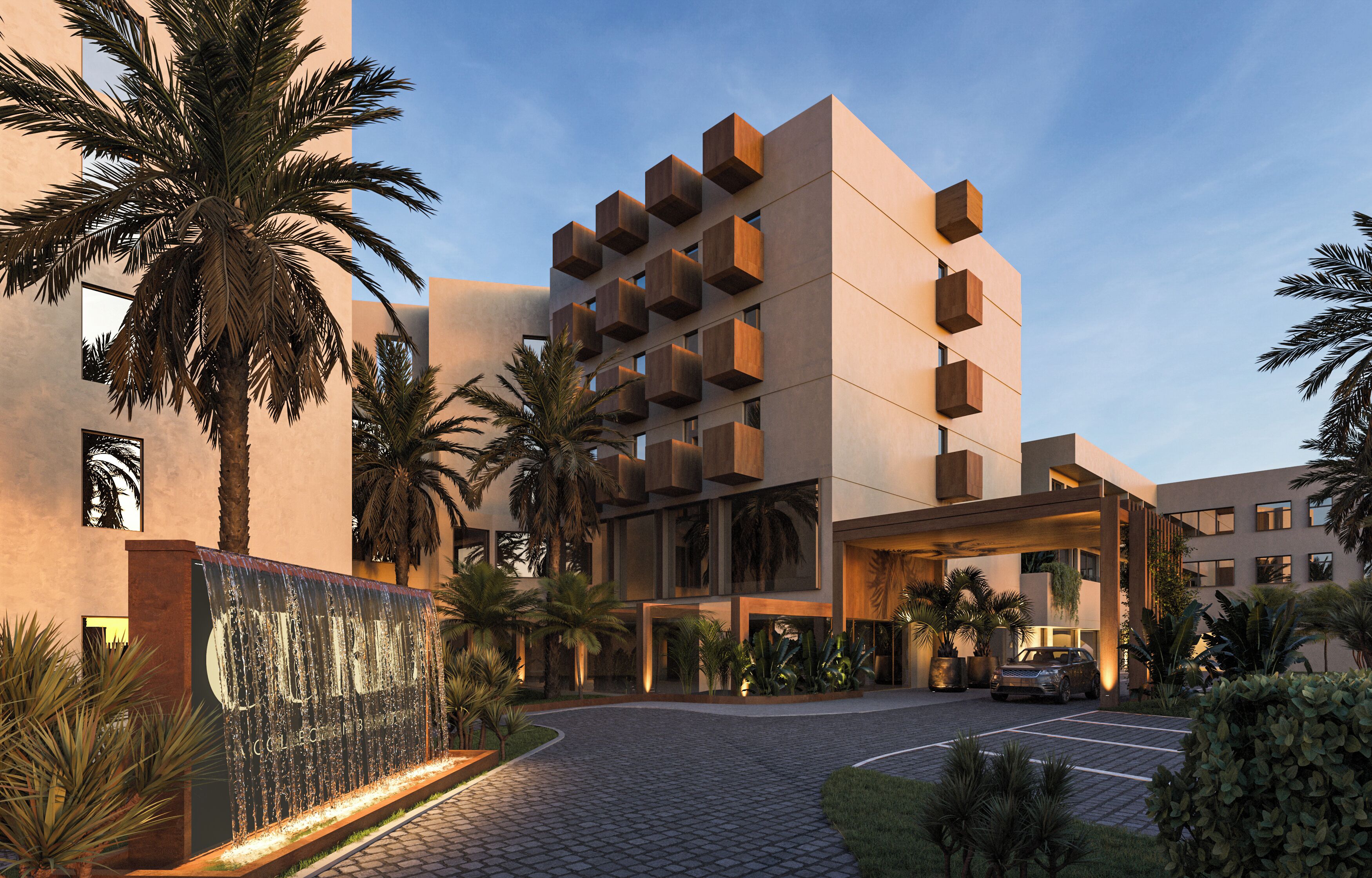 A modern hotel with a unique architectural design, featuring a central atrium and a parking area.
