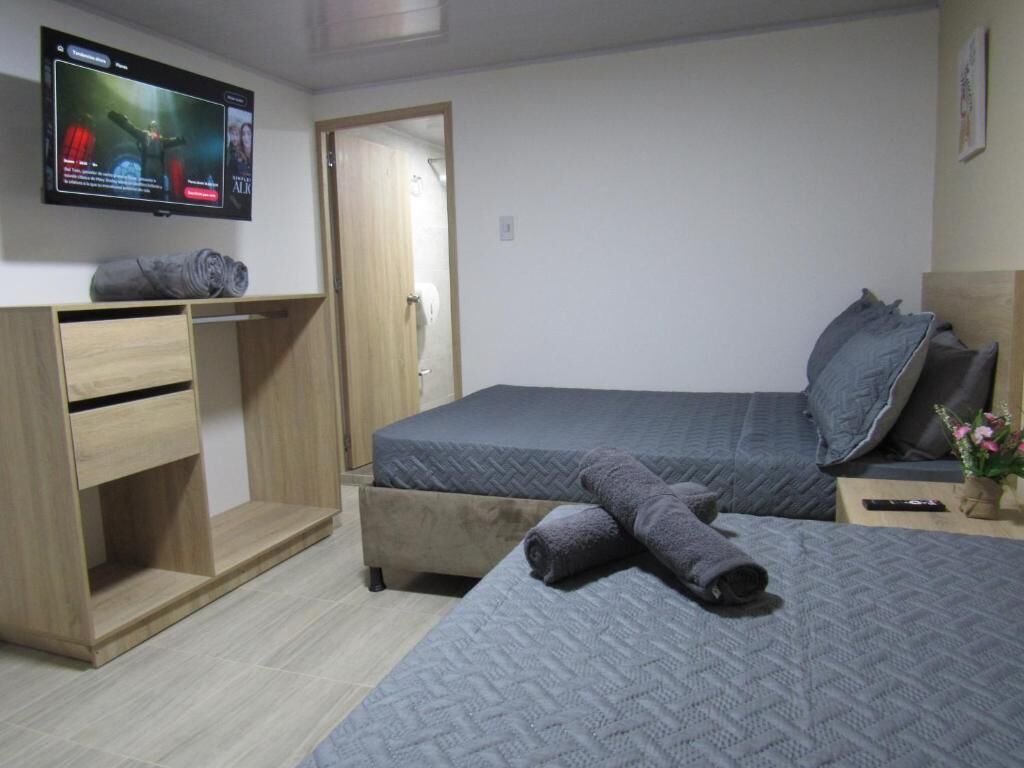 Quarto família | Cortinas blackout, ferros/tábuas de passar roupa, Wi-Fi de cortesia