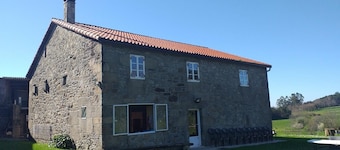 A rustic family home located in a village in Galicia, surrounded by countryside