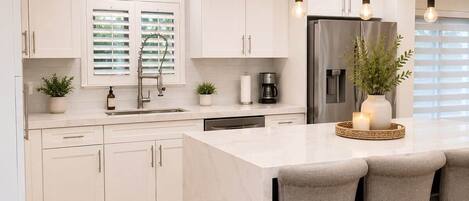 Coffee/tea maker, fridge, microwave, oven