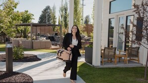 A modern building with a patio area, outdoor seating, and a well-maintained lawn. - Boutique Spa Resort Adults-Only | Designed for Relaxation (Idaho Falls)