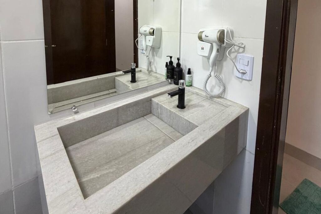 Shower, hair dryer, towels, toilet paper