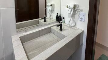 Shower, hair dryer, towels, toilet paper