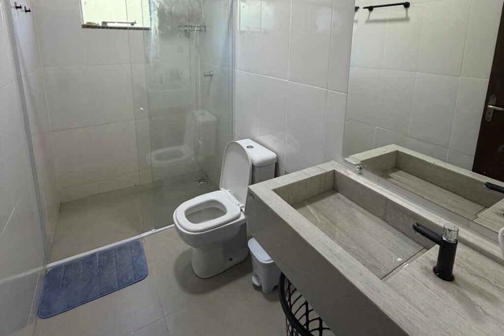 Shower, hair dryer, towels, toilet paper