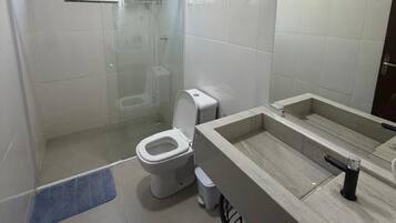 Shower, hair dryer, towels, toilet paper